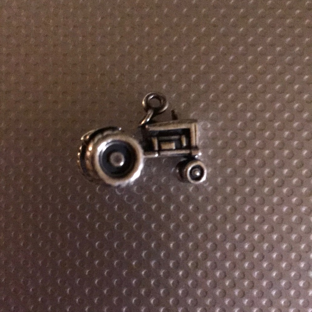 A vintage James Avery charm of a tractor.